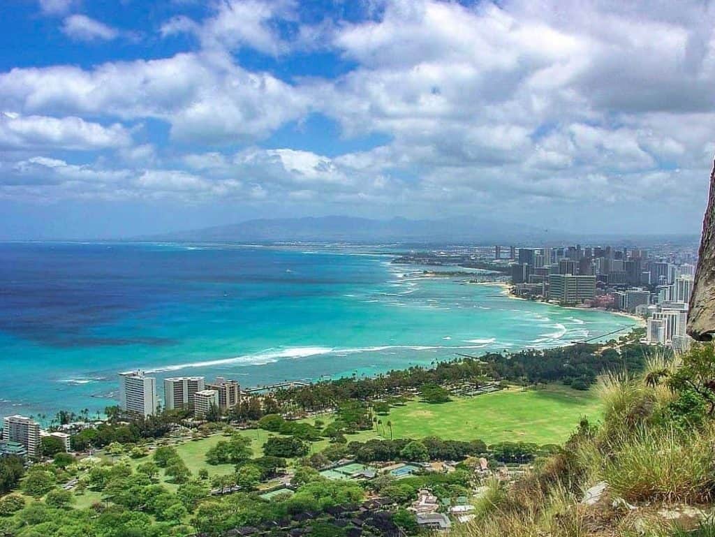 a view of on top of Diamond Head State Monument hike seeing waikiki beach
