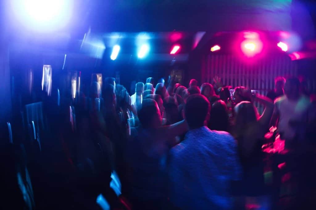 people dancing at the club at night