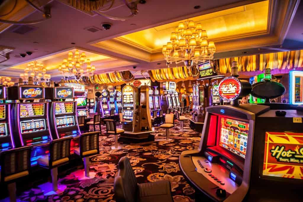 the las vegas casino floor with many slot machines to play while visiting