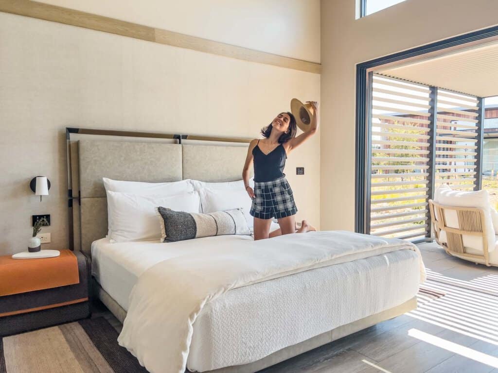 blogger on bed at Stanly ranch cottage